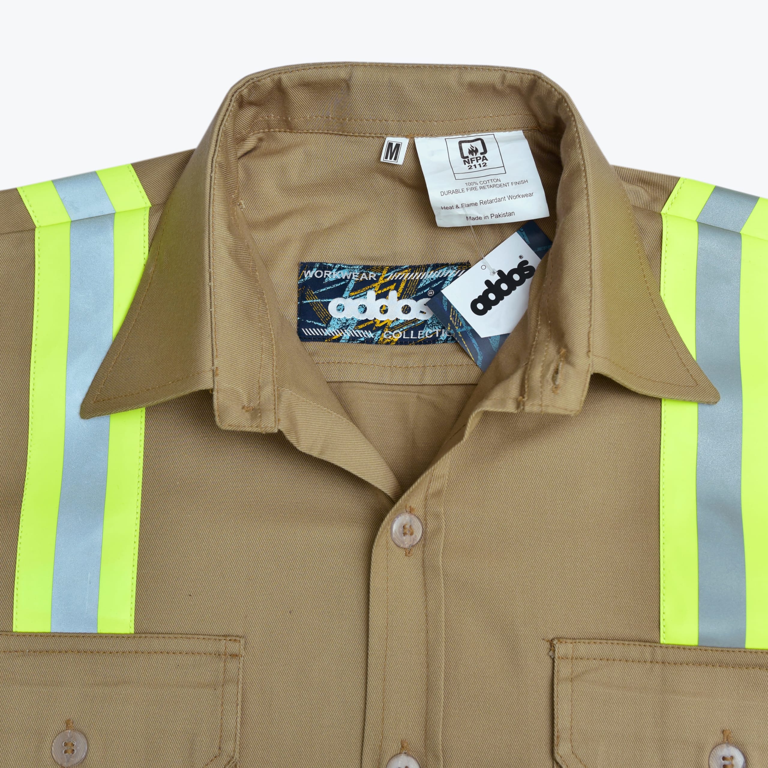 Close-up of a khaki flame-resistant work shirt with high-visibility reflective stripes and an Addos brand label.