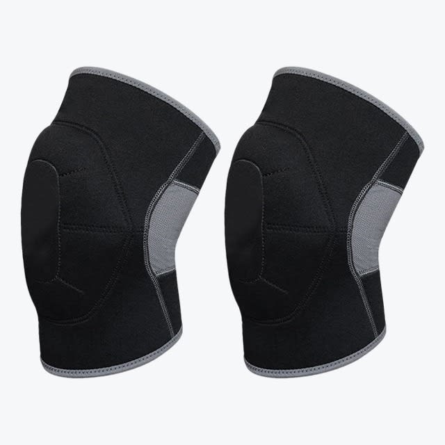 Two black compression knee sleeves with grey trim and a grey mesh back panel, shown side-by-side against a white background.