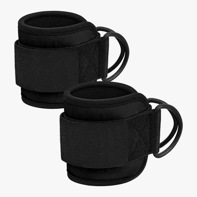 Two black padded ankle straps with double D-rings and velcro closures, shown against a plain white background.