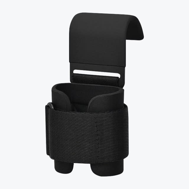 A single black weightlifting hook featuring a wide, coated metal hook and a padded, adjustable black wrist strap, isolated on a white background.