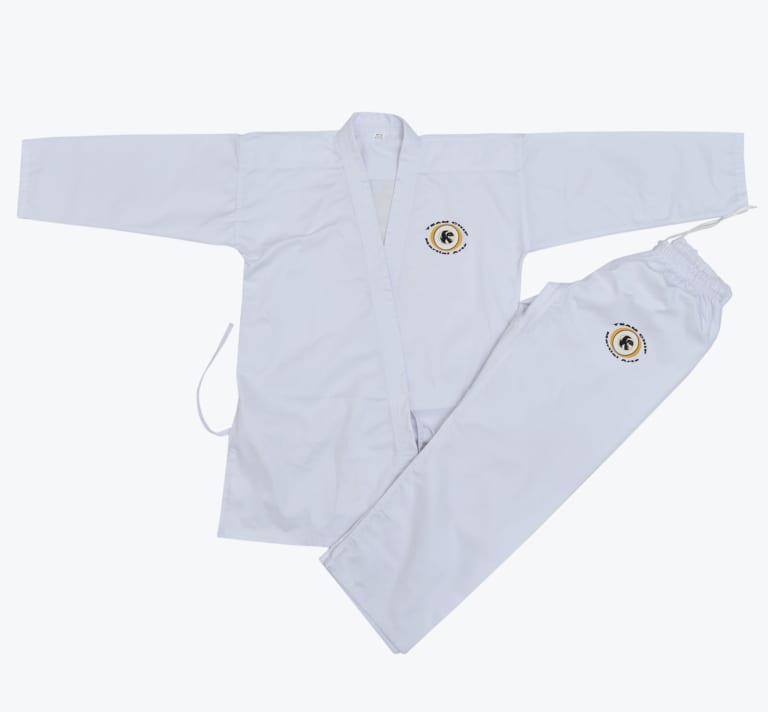 A white martial arts uniform consisting of a long-sleeved wrap jacket and matching pants, both featuring the Team Chip Martial Arts logo.