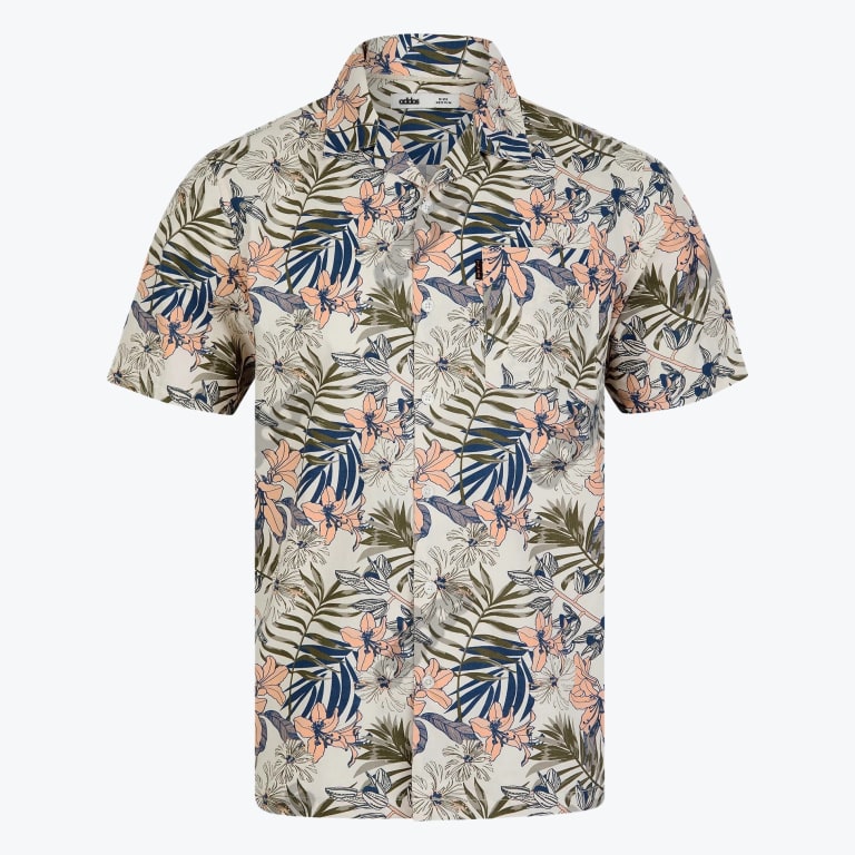 An Addos short-sleeved button-up shirt with a peach and green tropical floral pattern on an off-white background.