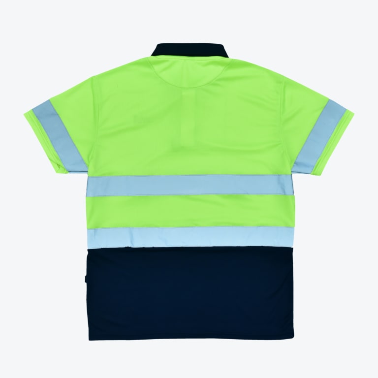Back view of a high-visibility polo shirt with a fluorescent green top, navy blue bottom, and silver reflective stripes.