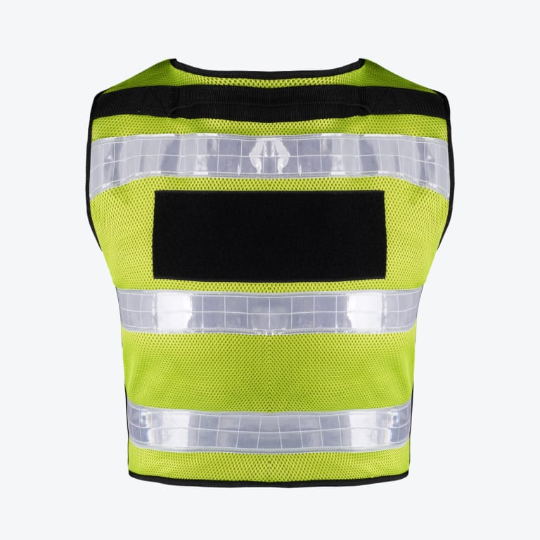 Back view of a neon yellow mesh safety vest with three horizontal reflective stripes and a large black rectangular patch in the center.