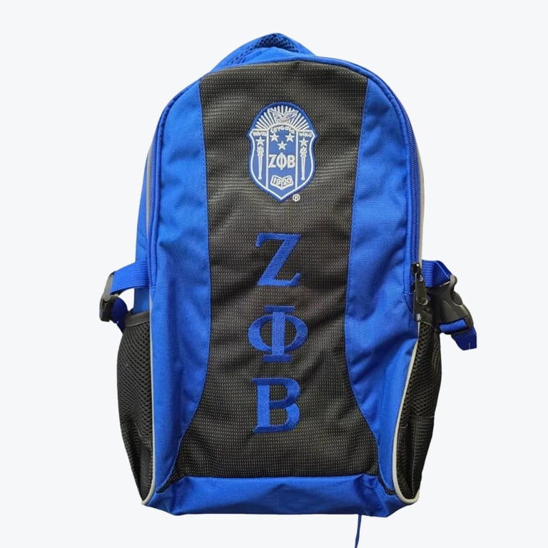 A royal blue and black backpack with the Zeta Phi Beta shield and vertical Greek letters ZΦB embroidered on the front.