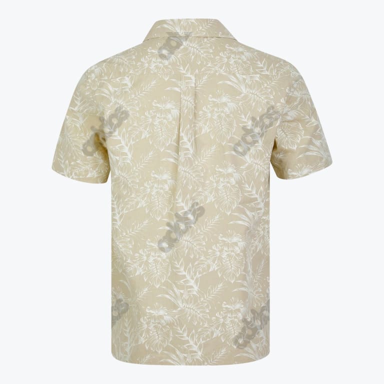 Back view of a light beige short-sleeve shirt with a white tropical leaf pattern.