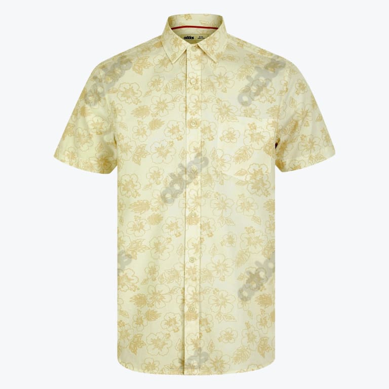 A light yellow short-sleeve button-up shirt with a subtle beige hibiscus floral pattern and a chest pocket, displayed flat against a white background.