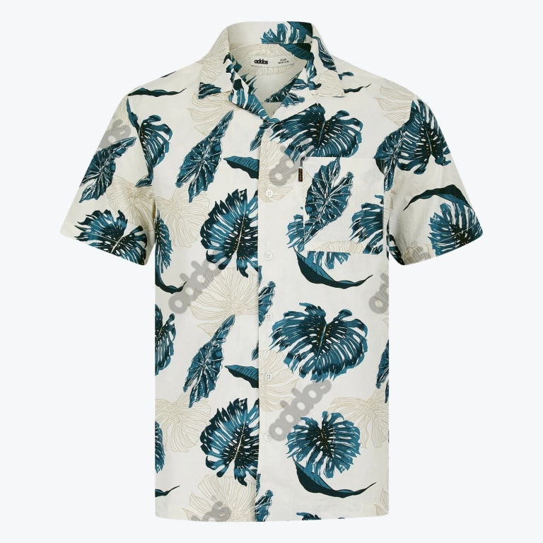 A white short-sleeve button-down shirt with a teal tropical leaf pattern and a chest pocket.