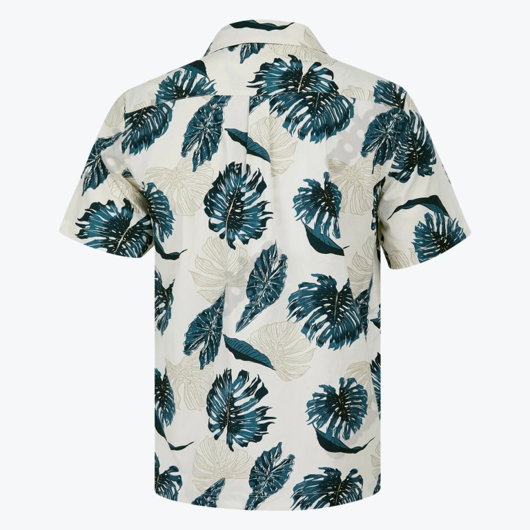 Back view of an off-white short-sleeved shirt with a green and teal tropical leaf pattern.