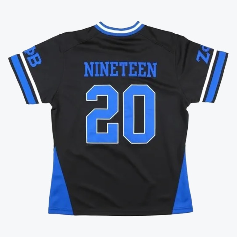 Back of a black athletic jersey with NINETEEN and in blue, featuring blue and white trim and Greek letters on the sleeves.