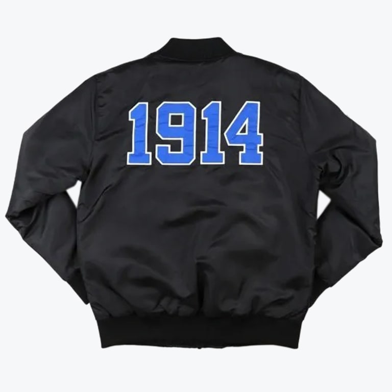 The back view of a black bomber jacket featuring the year '1914' in large blue varsity-style numbers with a white outline.