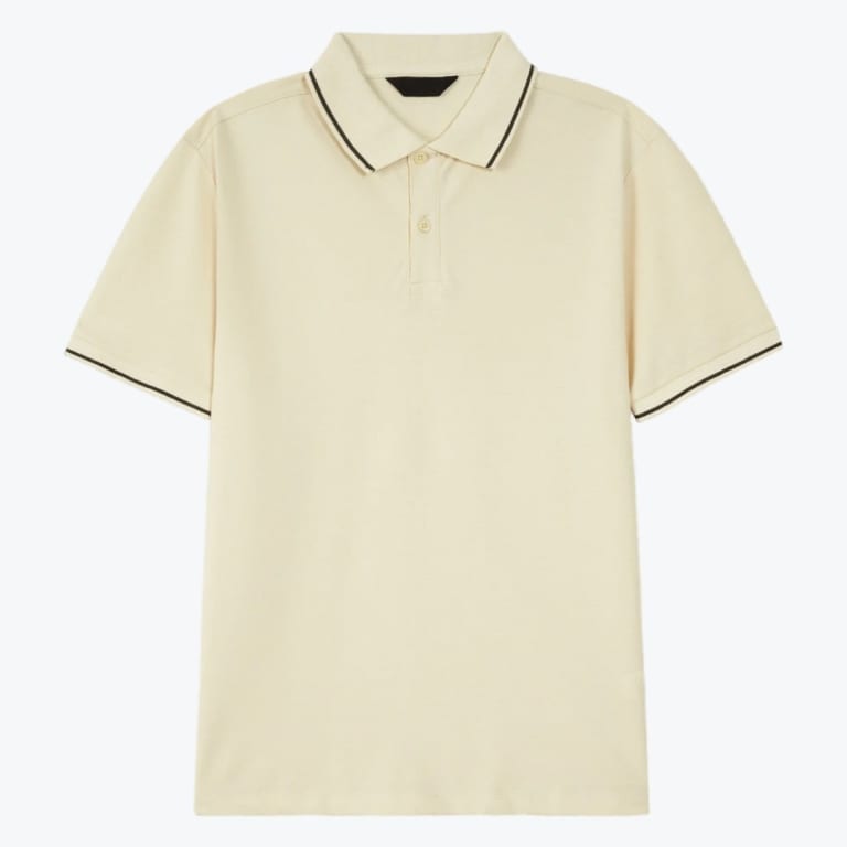 A cream-colored short-sleeved polo shirt with dark tipping on the collar and cuffs, displayed flat against a plain white background.