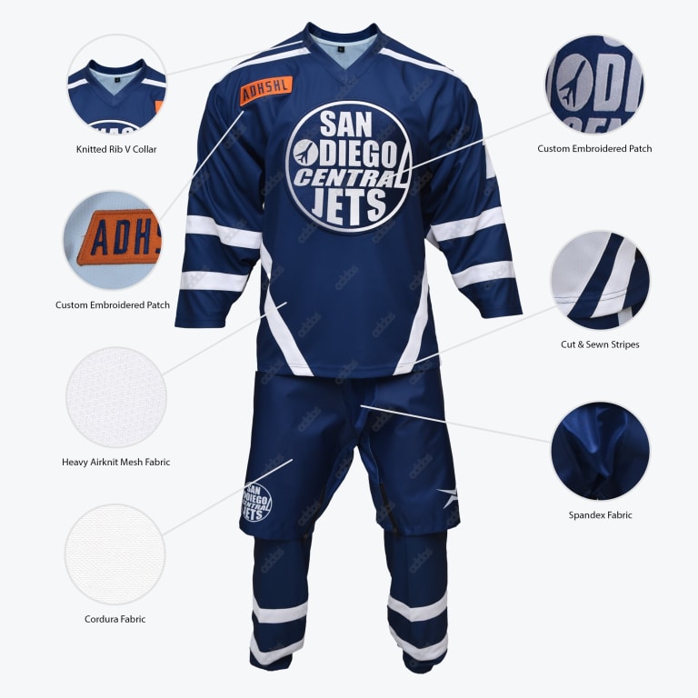 An infographic of a navy blue hockey uniform with white stripes and a circular San Diego Central Jets logo. Circular callouts highlight features like the knitted rib V-collar, custom embroidered patches, heavy airknit mesh fabric, Cordura fabric, cut and sewn stripes, and spandex fabric.