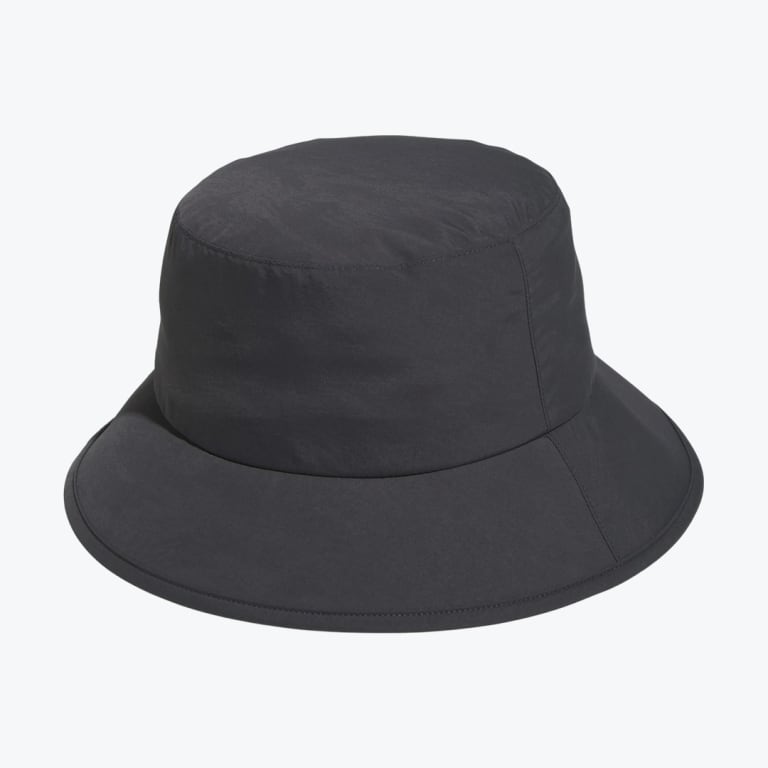 A solid black bucket hat with a wide brim, shot against a plain white background.