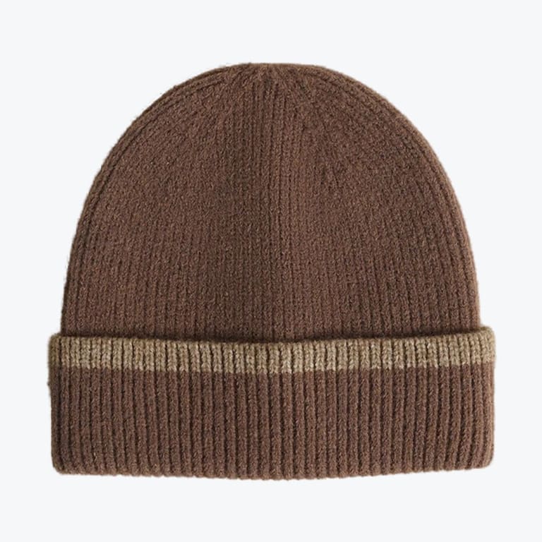 A brown ribbed knit beanie hat with a folded cuff and a thin tan stripe, isolated on a white background.