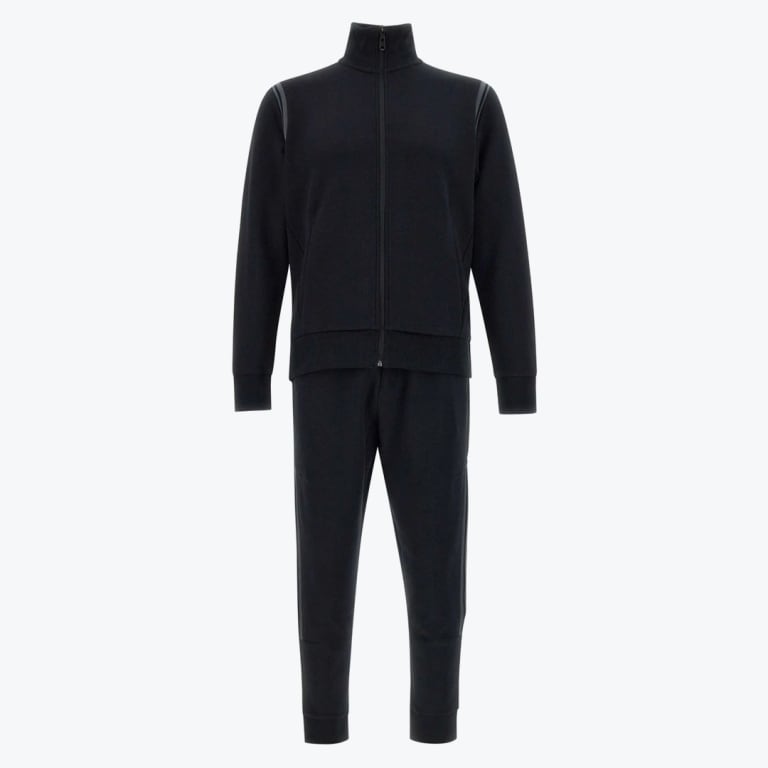 A two-piece black tracksuit with a full-zip high-collar jacket and matching joggers on a white background.