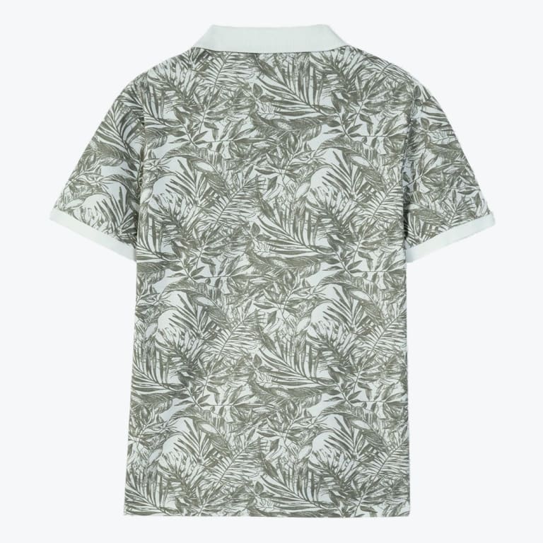 Back view of a light green polo shirt with a dense tropical leaf pattern, featuring a solid light-colored collar and sleeve cuffs.