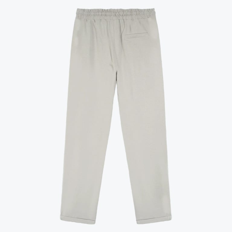 Back view of light grey straight-leg trousers with an elastic waistband and a single back welt pocket.