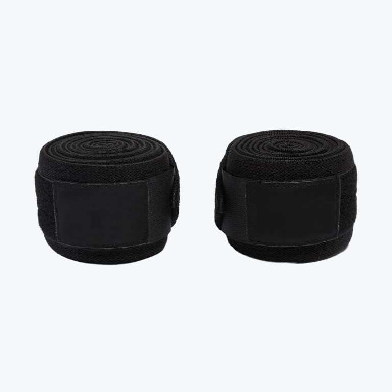 Two rolls of black athletic wraps with velcro closures side-by-side on a white background.