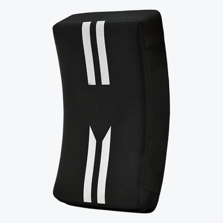 A black curved martial arts kick shield with white vertical stripes on a white background.