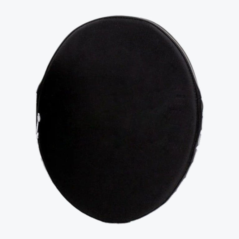 Top-down view of a black oval fabric cap with a stitched border on a white background.