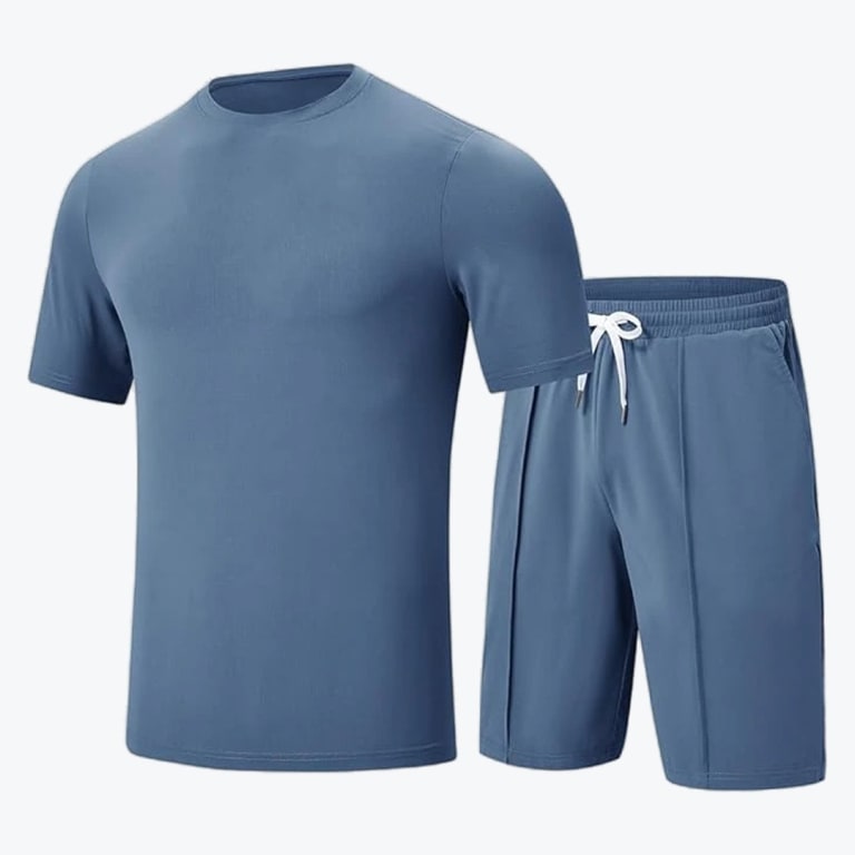 A two-piece mens athletic set in dusty blue, featuring a plain short-sleeve crew neck t-shirt and matching shorts with a white drawstring.