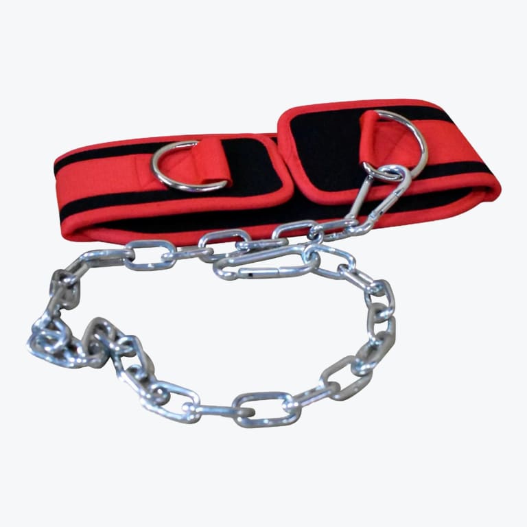 A red and black padded weightlifting dip belt with a metal chain and carabiner clip, isolated on a white background.