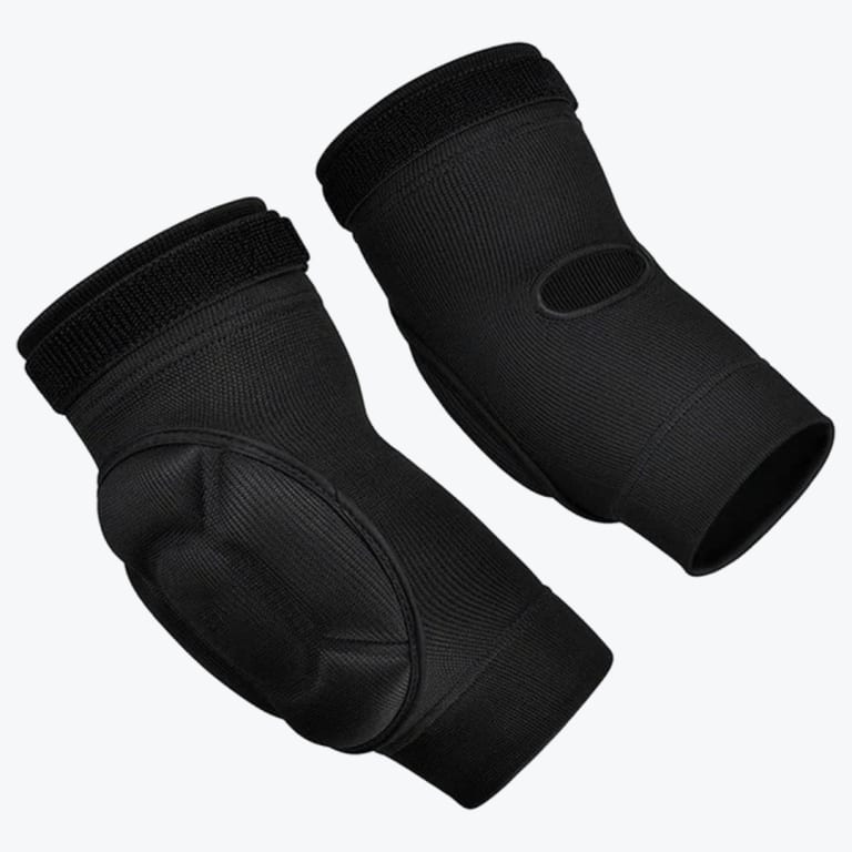 A pair of black protective elbow pads on a white background, showing both the padded front and the cutout back.