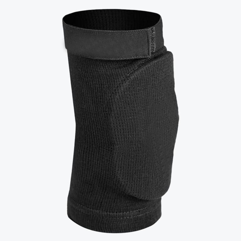 A black padded knee sleeve with an adjustable top strap, shown against a plain white background.