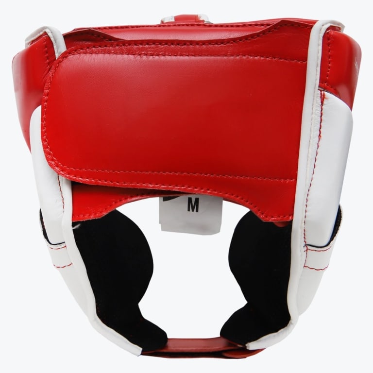 Rear view of a red and white leather boxing headgear with a hook-and-loop closure and a size M tag, isolated on a white background.