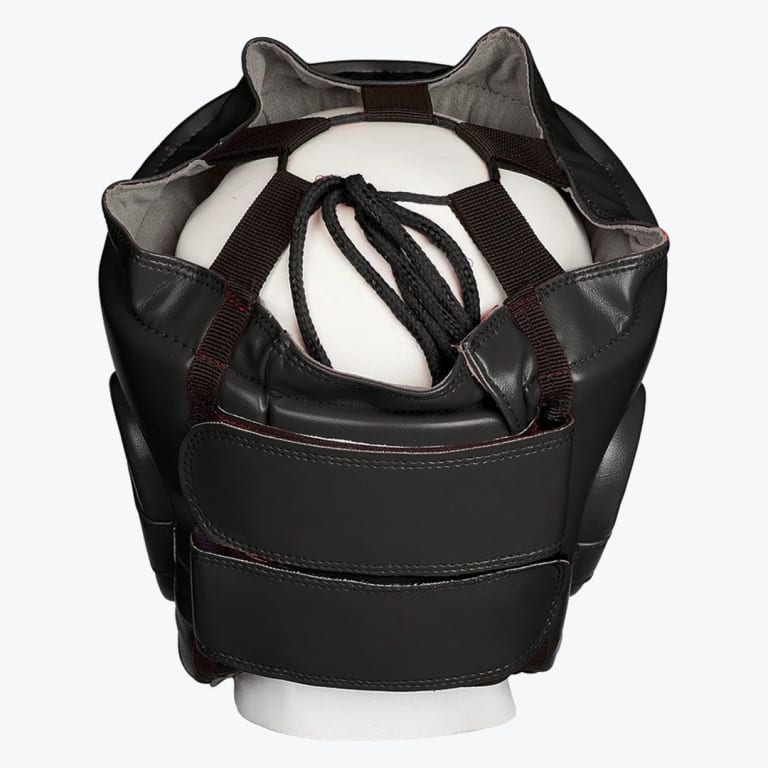Back view of a black boxing headgear with adjustable hook-and-loop straps and a lace-up top on a white mannequin head.