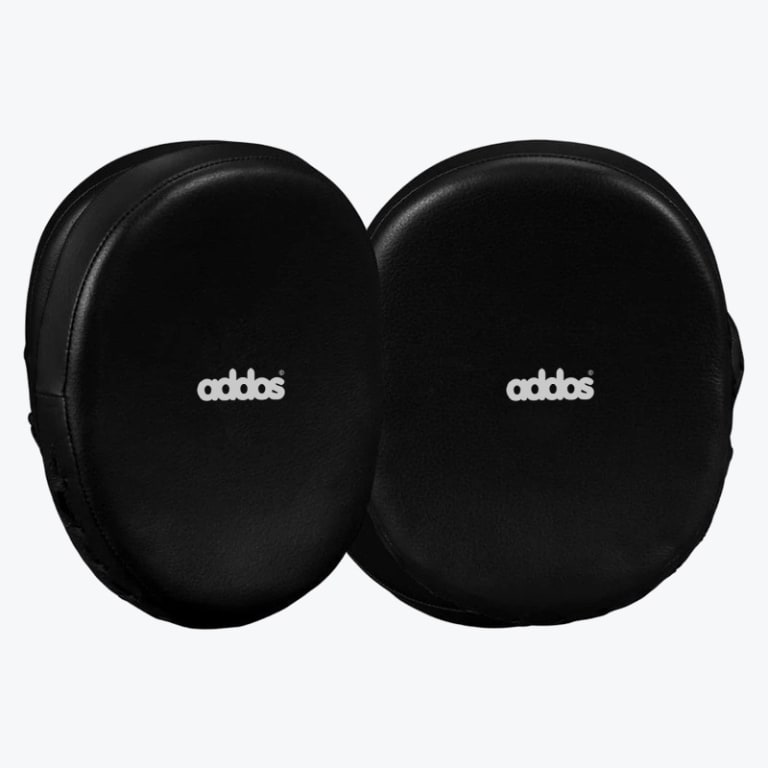 A pair of black oval-shaped boxing focus mitts with the white addos logo in the center, displayed on a white background.