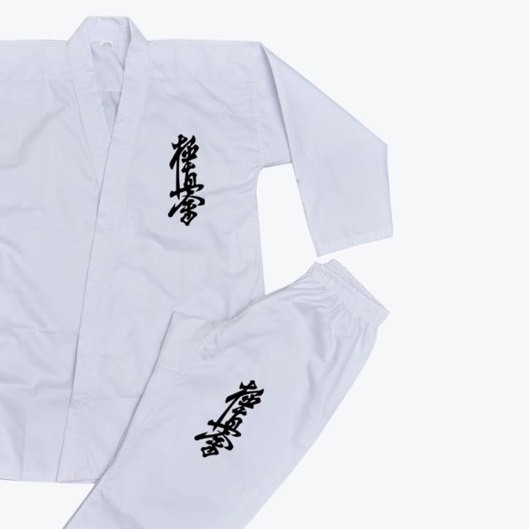 A white Kyokushin Karate gi jacket and pants set with black kanji embroidery, displayed on a plain light background.