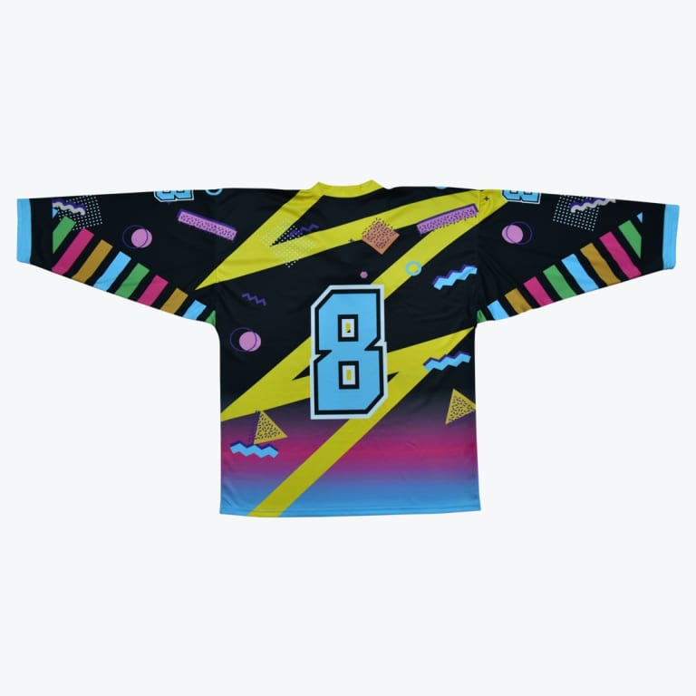 Back view of a black hockey jersey with a colorful 90s Memphis design, featuring a large light blue number 8, yellow lightning bolts, and multi-colored geometric patterns.