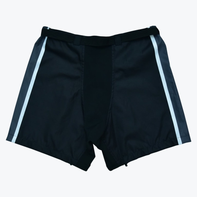 A pair of black athletic shorts with grey side panels and white vertical stripes on a plain white background.