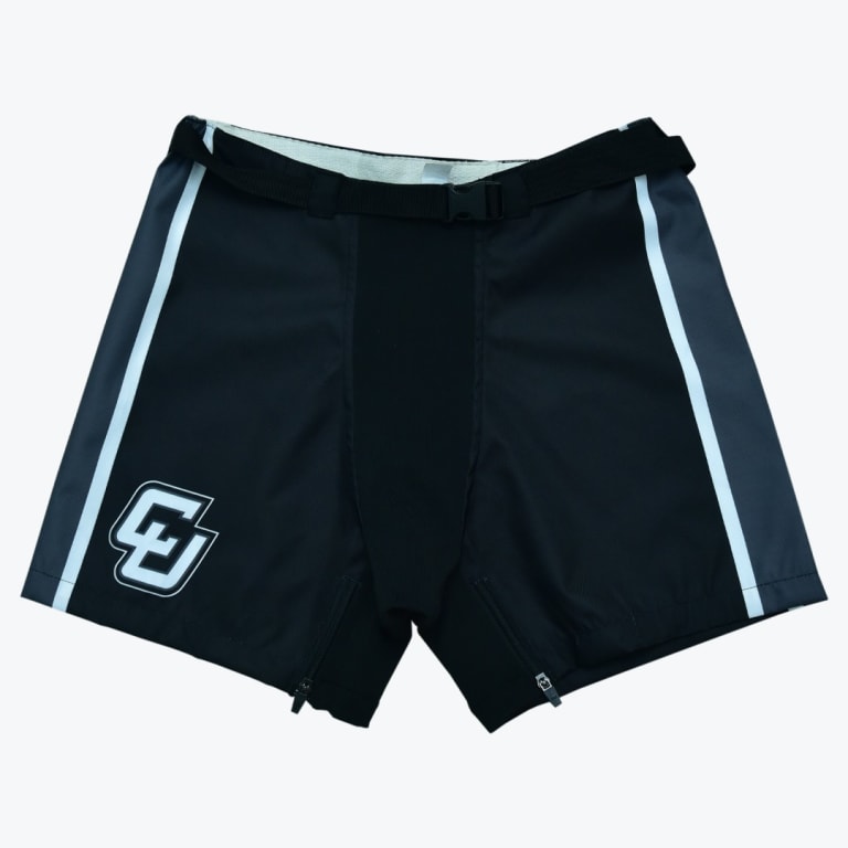 Front view of black hockey girdle shell shorts with an integrated belt, white side stripes, and a stylized logo on the lower right leg.