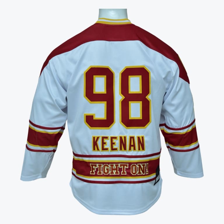 Back view of a white, red, and gold hockey jersey with the number 98, the name KEENAN, and the text FIGHT ON! on the back.