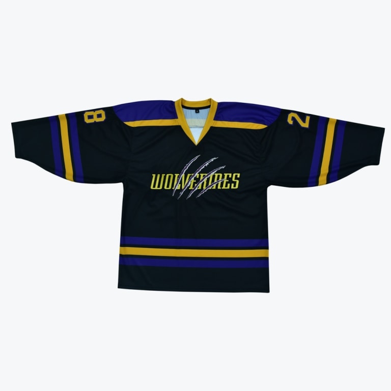 A black hockey jersey with WOLVERINES written in yellow across the front, slashed by claw marks, with purple and gold stripes on the sleeves and hem.