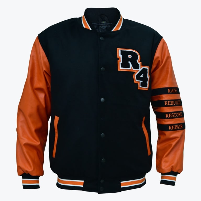 A black varsity jacket with orange faux-leather sleeves, featuring a large R4 patch on the chest and the words RAISE, REBUILD, RESTORE, REPAIR embroidered on the left sleeve.