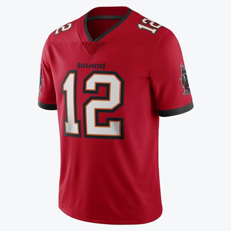 A red Tampa Bay Buccaneers jersey with the number 12 in white with black and orange trim, displayed against a plain white background.
