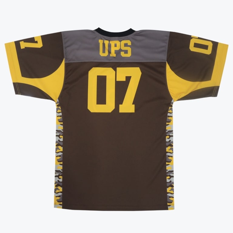 The back view of a brown and yellow football jersey with UPS and the number 07 in yellow.