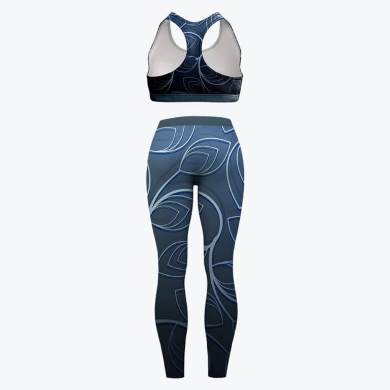 Back view of a matching women sports bra and leggings set with a blue and grey abstract leaf pattern on a white background.