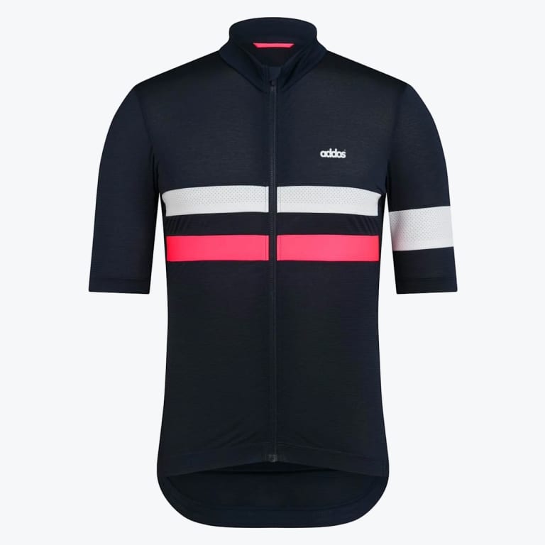 Front view of a navy blue short-sleeved cycling jersey with a white and pink stripe across the chest and a white band on the left sleeve.