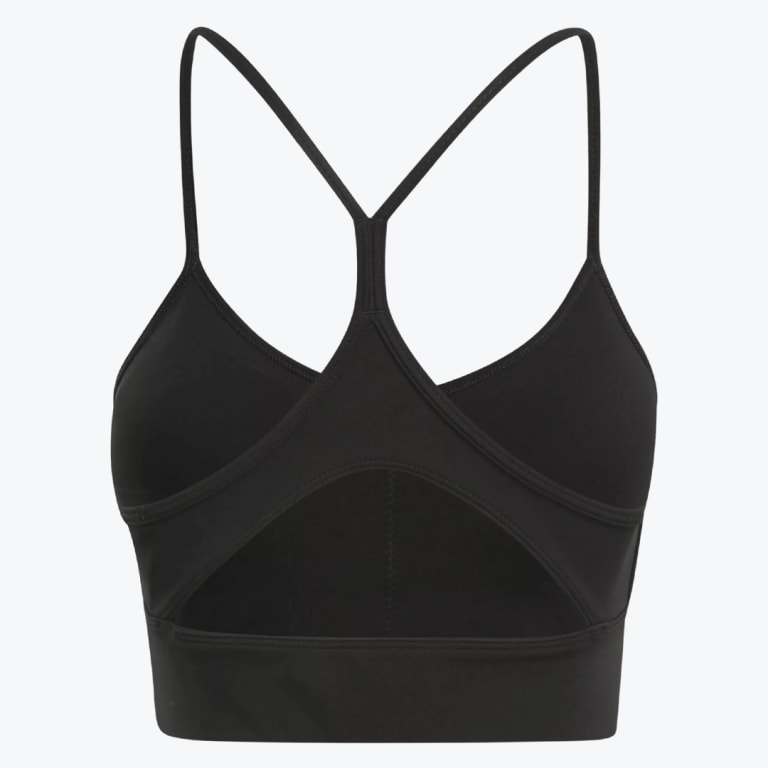 Back view of a black sports bra with thin straps and a triangular cutout on the back.