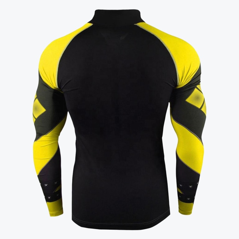Back view of a tight-fitting black and yellow athletic compression shirt with superhero-themed patterned sleeves.