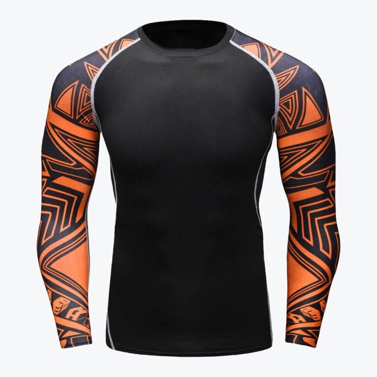 A long-sleeved compression shirt with a solid black torso and orange sleeves featuring black tribal tattoo designs, displayed against a white background.