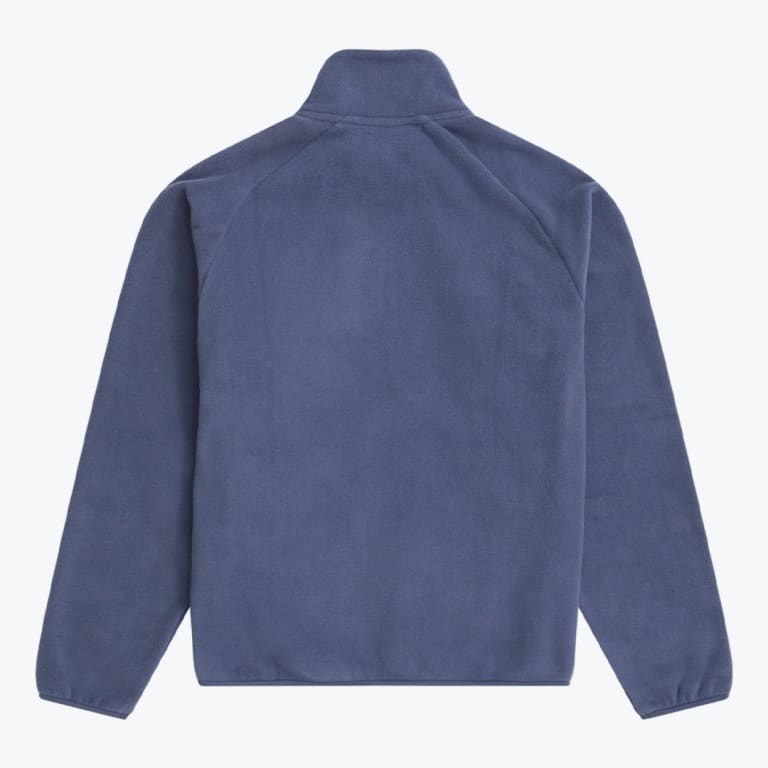 The back view of a slate blue fleece jacket with raglan sleeves and a high collar, laid flat on a white background.