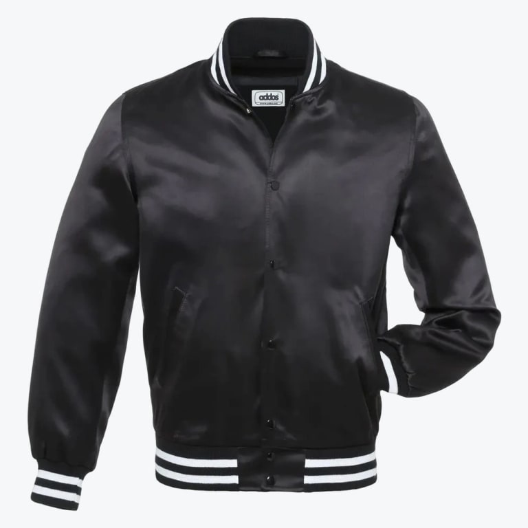 A black satin varsity jacket with white striped ribbing on the collar, cuffs, and hem, set against a plain white background.