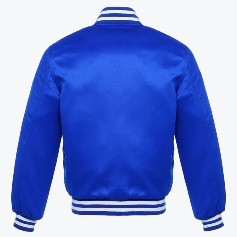 Back view of a royal blue satin varsity jacket with blue and white striped ribbed trim on a white background.