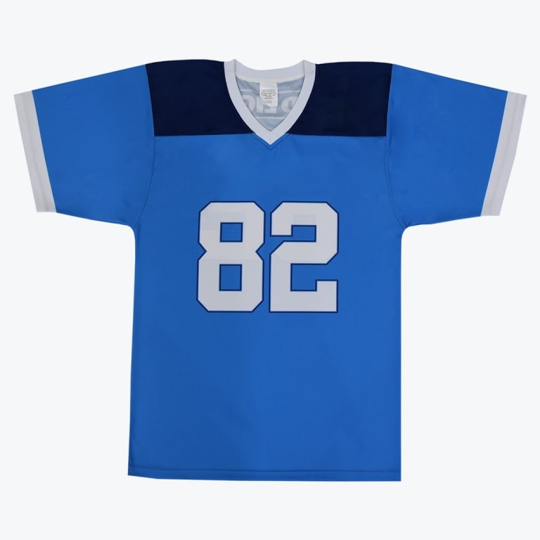 A light blue short-sleeved football jersey with dark blue shoulders and the number 82 in white on the front, set against a plain white background.